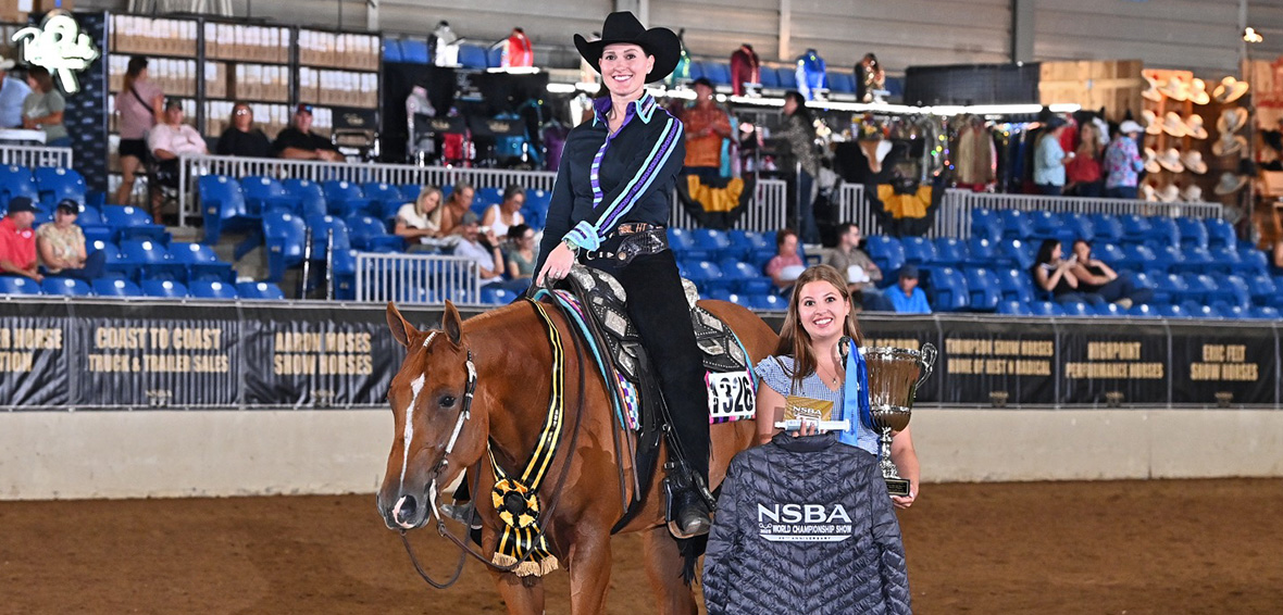 Hillary Timchak riding a sorrel horse
